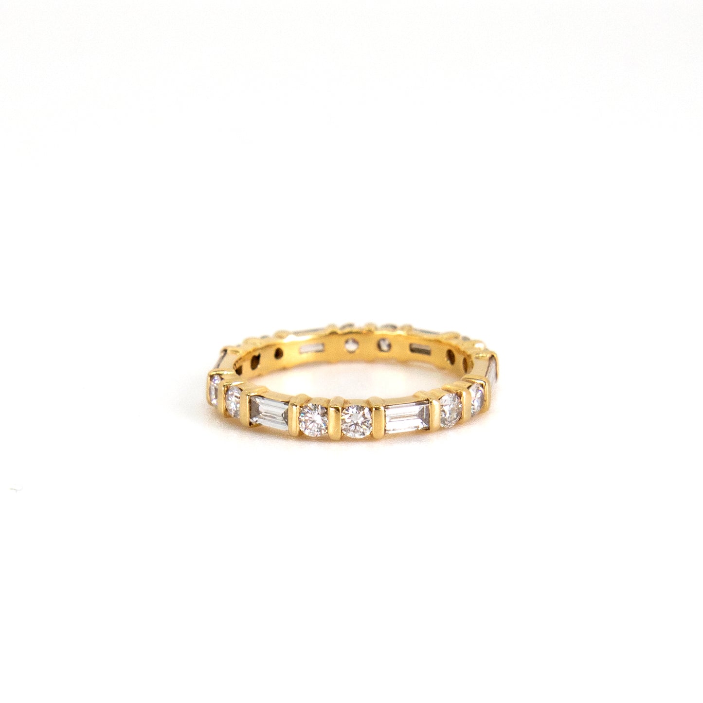 Baguette and round diamond eternity ring