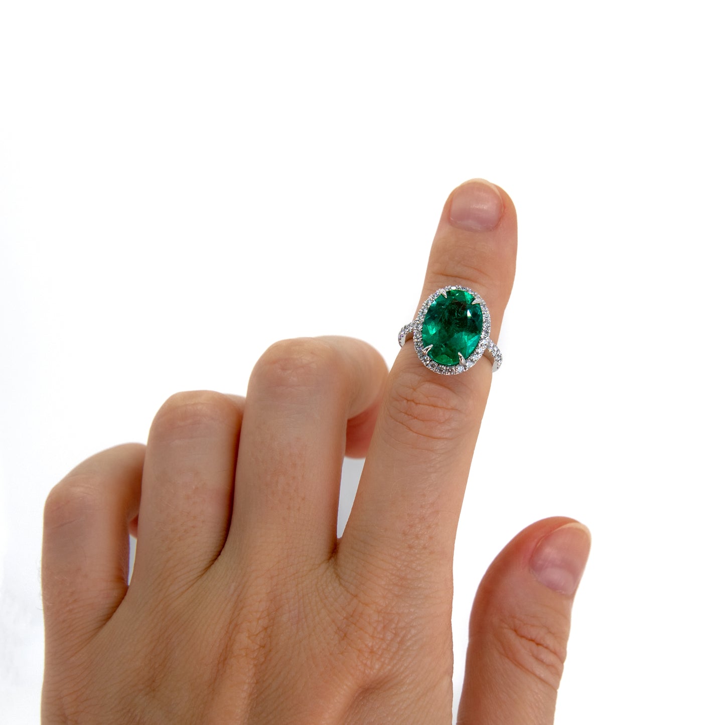 4 carat oval emerald and diamond halo ring in gold or platinum by Valentina Fine Jewellery Hong Kong. Global free shipping including USA, UK, Singapore, Australia and Dubai.