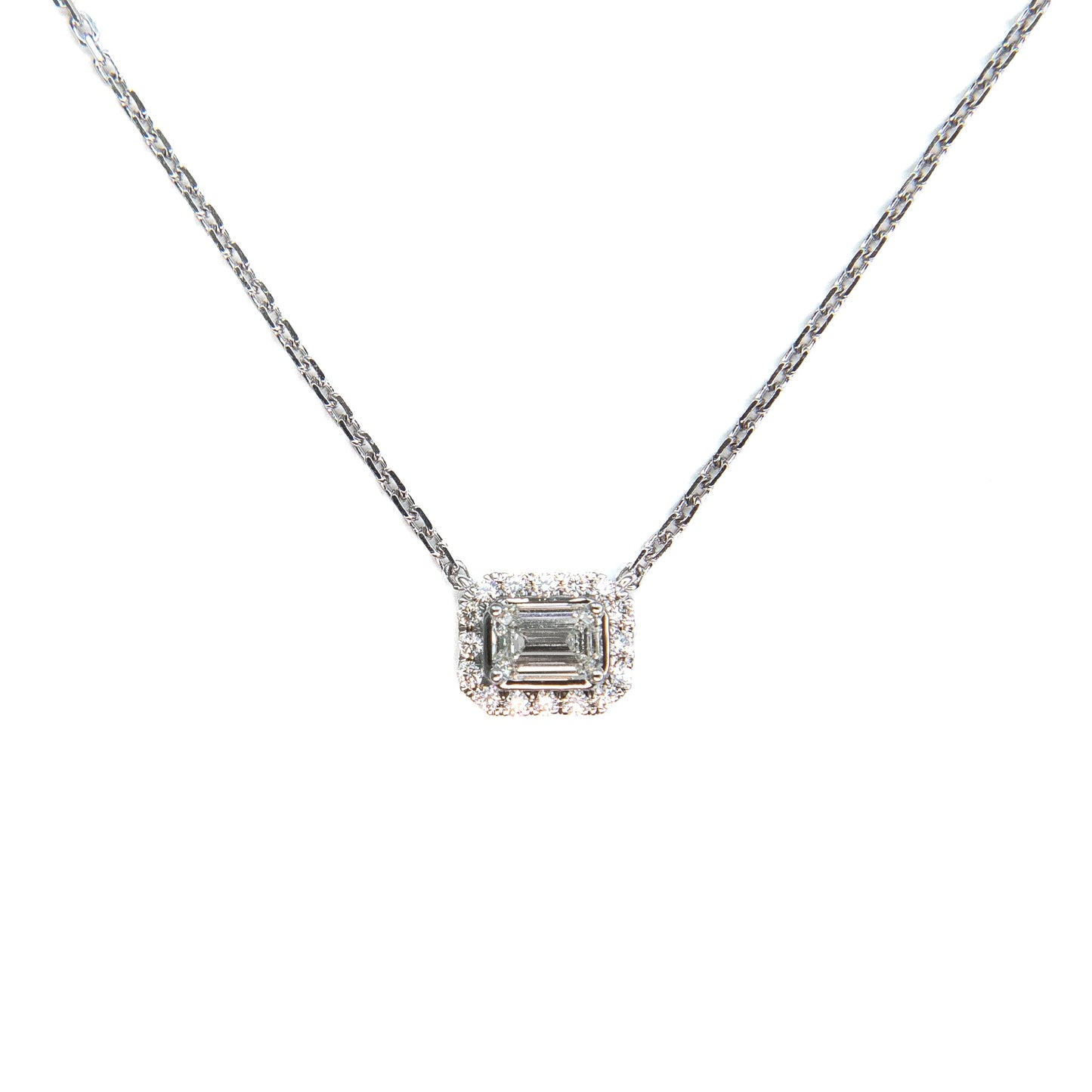 Emerald cut diamond and halo necklace