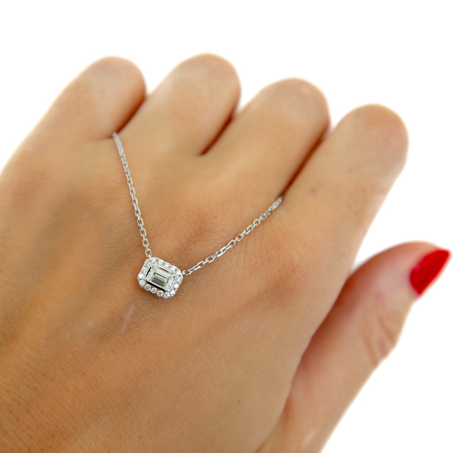 Emerald cut diamond and halo necklace in White Gold