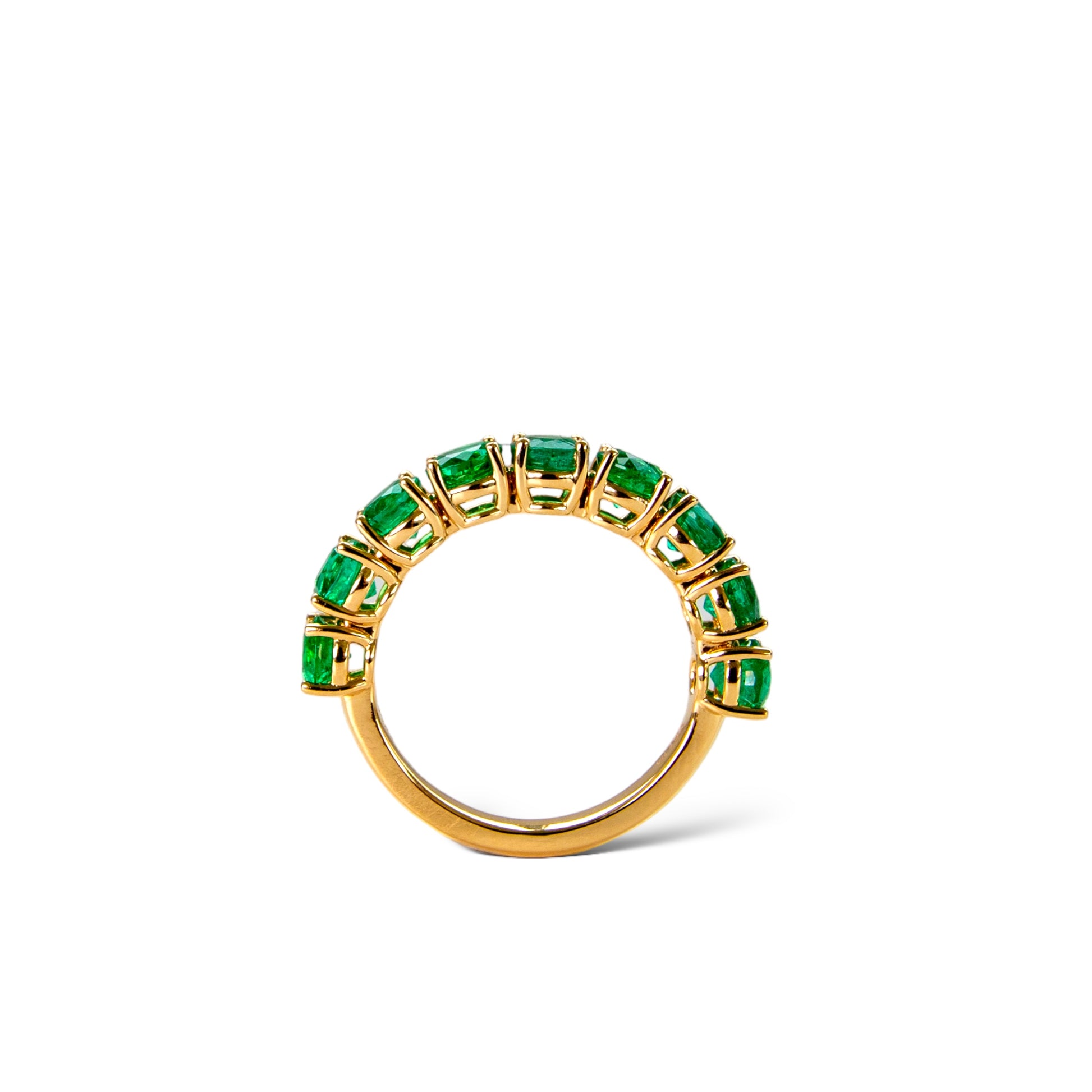 Green Zambian emerald eternity rings in platinum and 18k yellow gold by Valentina Fine Jewellery Hong Kong. Global free shipping including USA, Australia, UK, Singapore and Taiwan.