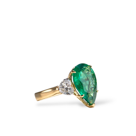 Show-stopping 5.65ct green pear cut emerald ring with heart shape diamonds in 18k gold by Valentina Fine Jewellery Hong Kong. Free global shipping including USA