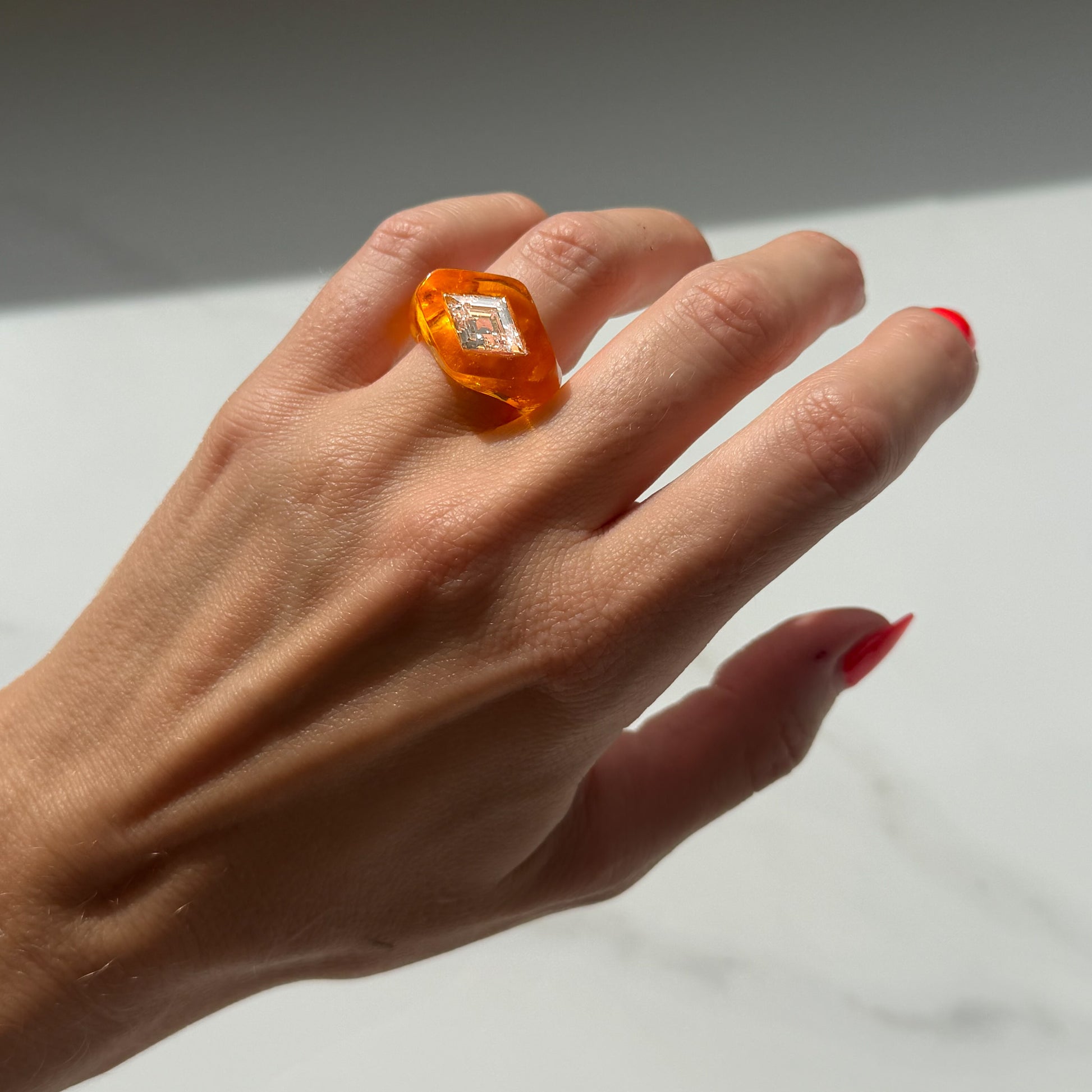 Fanta, Baby: glowing orange lucite and lozenge diamond ring hand carved by Anastasia at Valentina Fine Jewellery Hong Kong. Global free shipping including USA, Canada, Australia, UK and Singapore