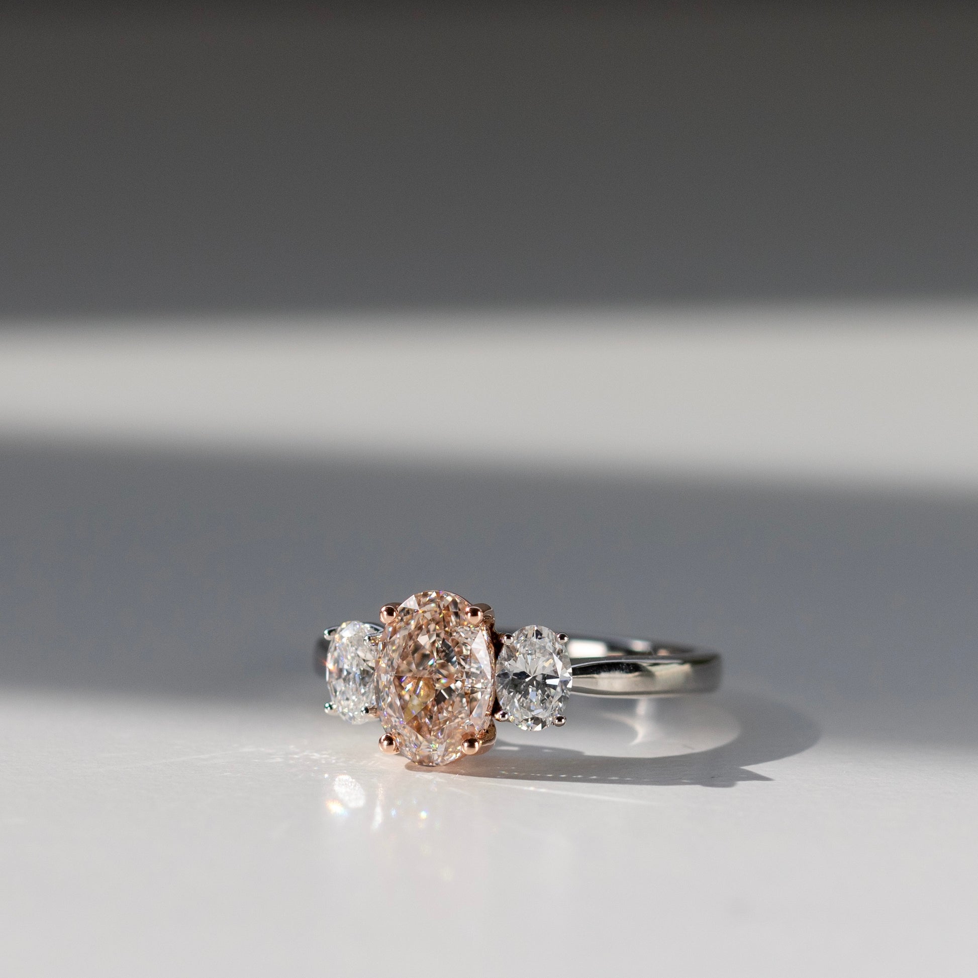 1.50 carat diamond oval engagement ring with oval side diamonds by Valentina Fine Jewellery Hong Kong. Global free shipping including China, Australia, USA, Singapore and Taiwan. Oval pink natural diamond oval engagement ring on a budget.