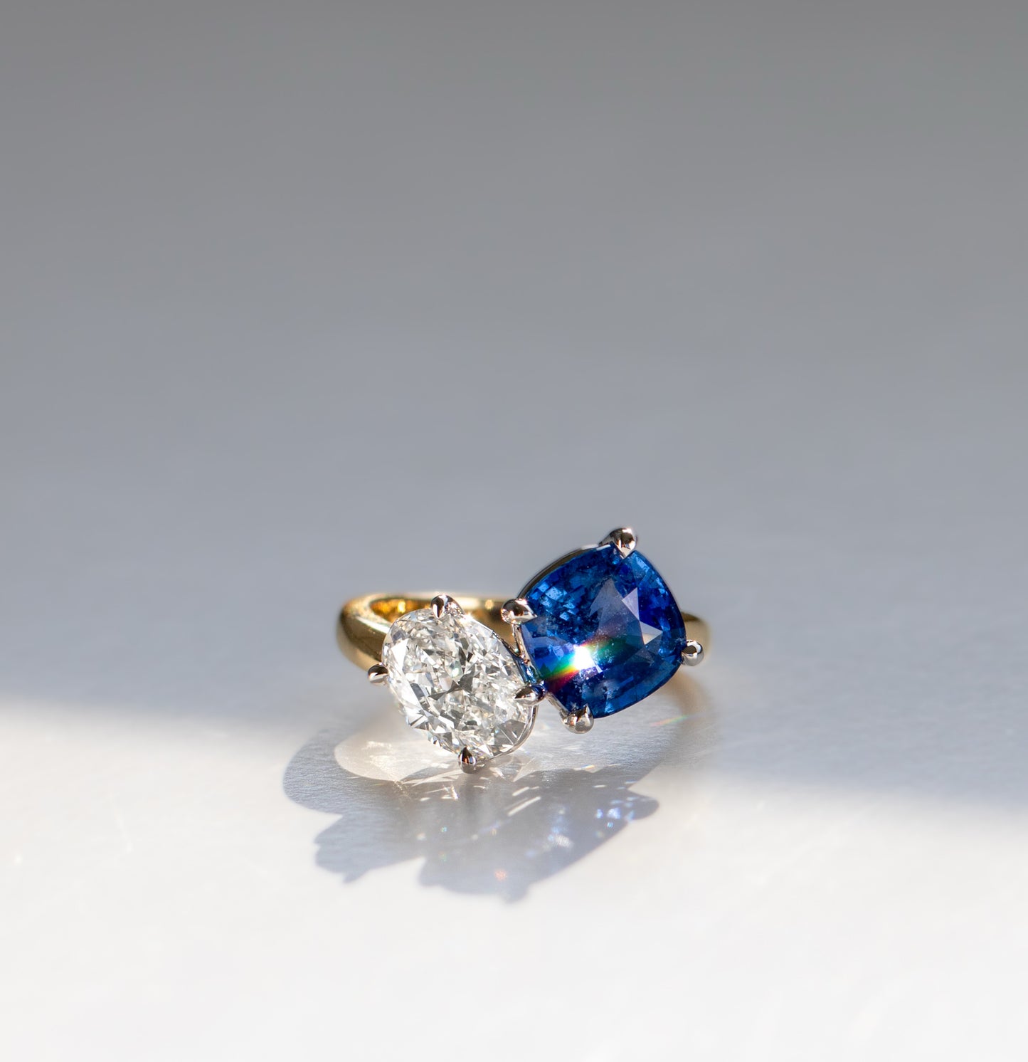 Asymmetrical crossover sapphire and diamond toi et moi engagement ring in 18k gold by Valentina Fine Jewellery Hong Kong. Global free shipping including USA, Australia, China and New Zealand.