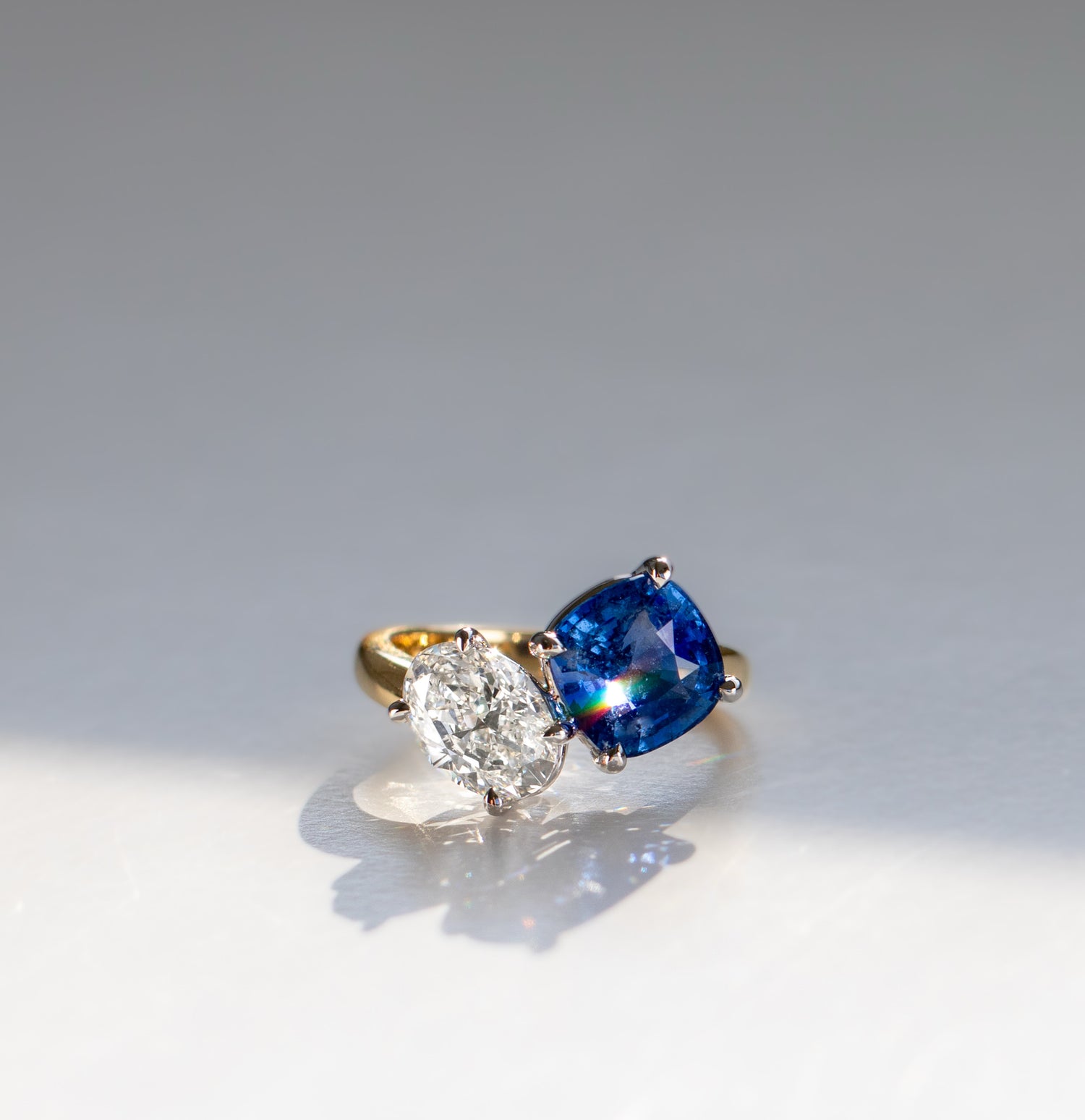 Asymmetrical crossover sapphire and diamond toi et moi engagement ring in 18k gold by Valentina Fine Jewellery Hong Kong. Global free shipping including USA, Australia, China and New Zealand.