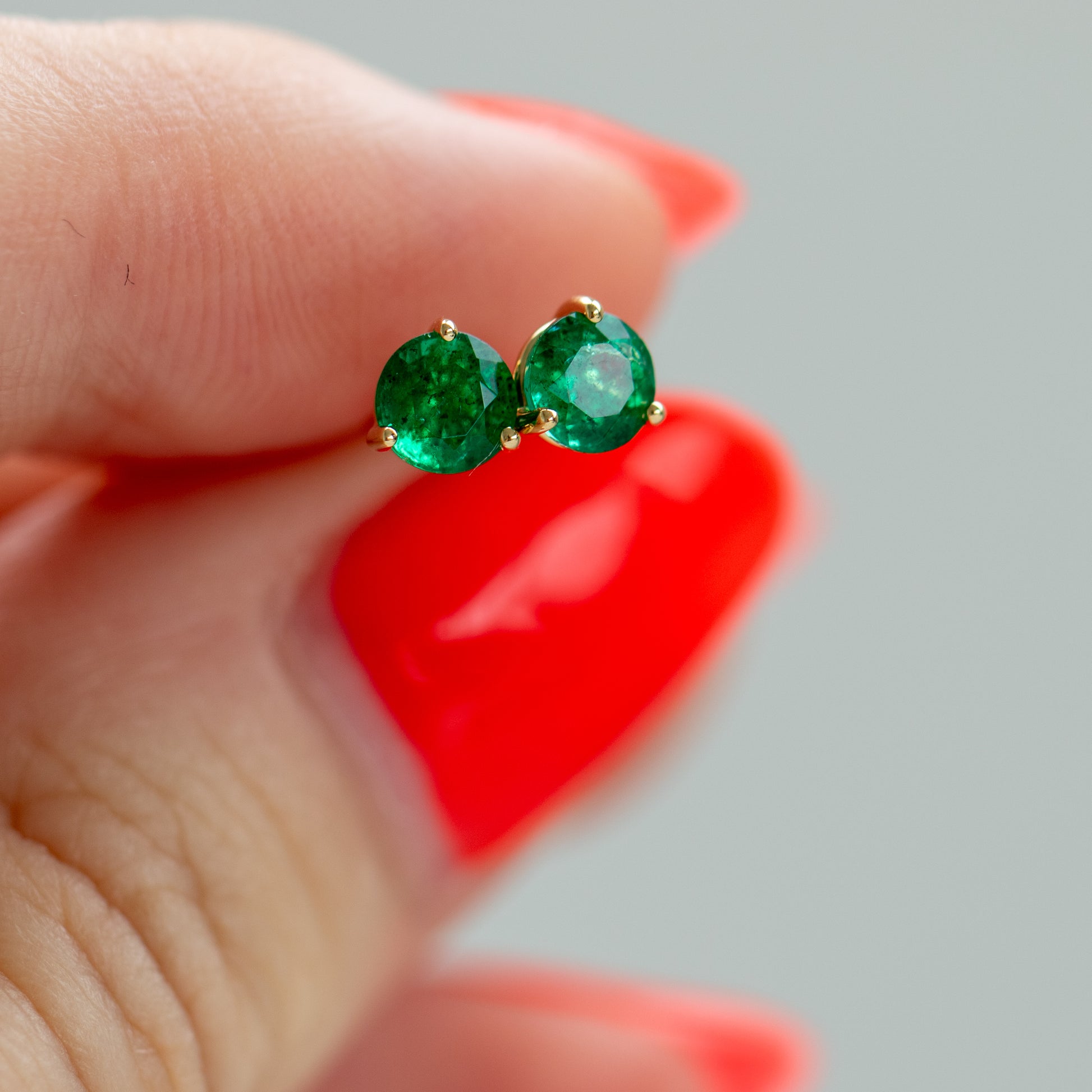 Natural green emerald stud earrings in 18k yellow gold by Valentina Fine Jewellery Hong Kong USA. Green emerald studs