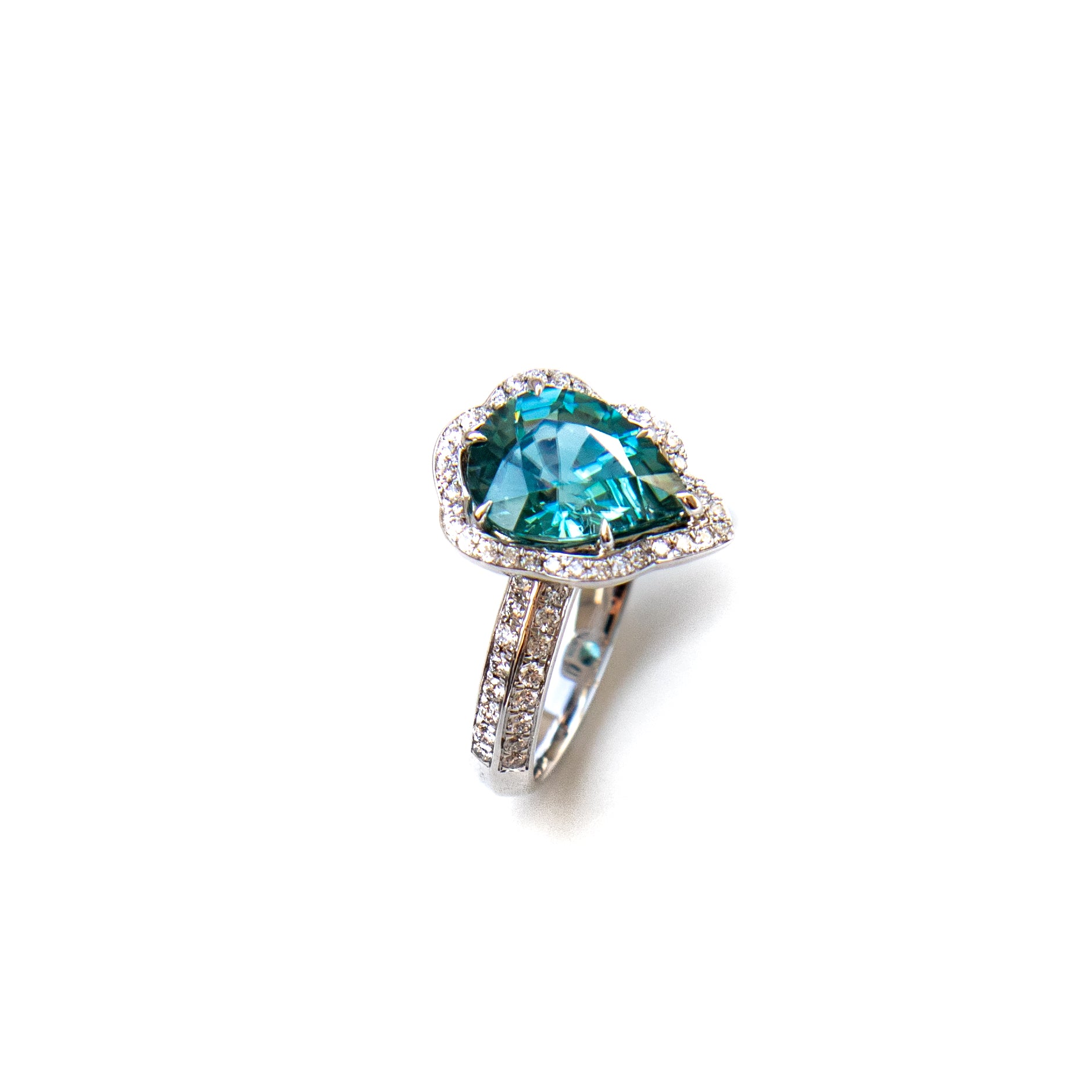 Ornate diamond halo and natural zircon ring